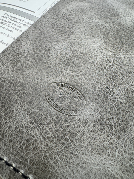 Close-up of a textured surface with a circular logo and text.