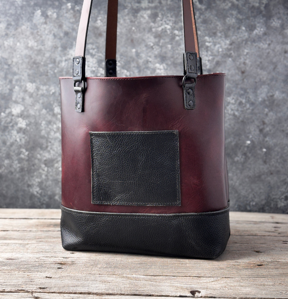 Interior view of handmade burgundy leather tote bag showing unlined leather