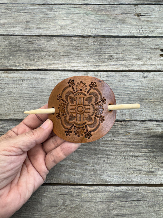 Intricately hand stamped Zia Sun leather hair barrette with bamboo hair stick.