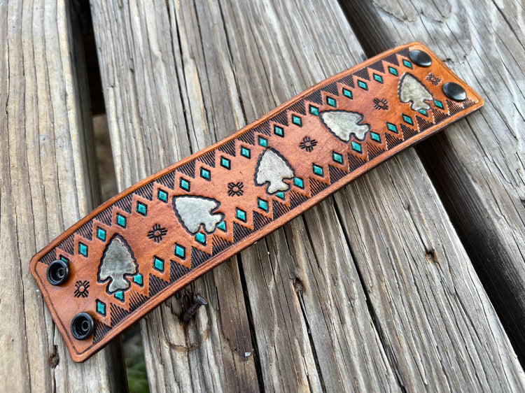 handmade leather cuff with stamped arrowhead design