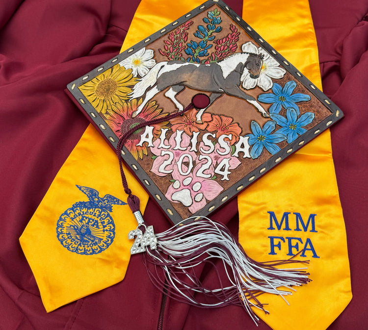 Custom tooled leather graduation cap topper with hand-carved floral design, personalized initial, handmade in Texas by Cherokee Rose Custom Leather
