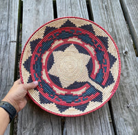 Hand woven wall decor basket in Southwestern Pattern