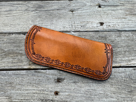 Hand stamped leather eyeglasses case with barbed wire and geometric Western pattern, handmade by Cherokee Rose Custom Leather