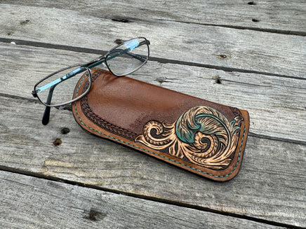 Hand tooled leather eyeglasses case with turquoise feather and floral corner design, handmade by Cherokee Rose Custom Leather