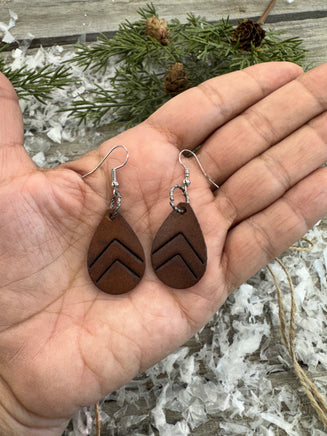 Small dark chocolate leather teardrop earrings with embossed Chevron lines and sterling silver hooks, handmade by Cherokee Rose Custom Leather in East Texas.