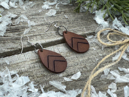 Small dark chocolate leather teardrop earrings with embossed Chevron lines and sterling silver hooks, handmade by Cherokee Rose Custom Leather in East Texas.