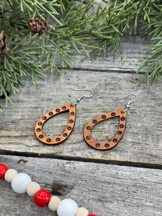 Teardrop-shaped leather earrings with hand-stamped dotted border and sterling silver ear wires, handmade by Cherokee Rose Custom Leather in East Texas.
