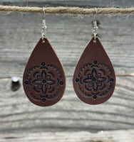 Large hand-stamped leather teardrop earrings with flower and geometric design, chocolate brown with sterling silver hooks, handmade by Cherokee Rose Custom Leather in East Texas.