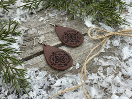 Large hand-stamped leather teardrop earrings with flower and geometric design, chocolate brown with sterling silver hooks, handmade by Cherokee Rose Custom Leather in East Texas.