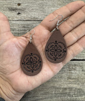 Large hand-stamped leather teardrop earrings with flower and geometric design, chocolate brown with sterling silver hooks, handmade by Cherokee Rose Custom Leather in East Texas.