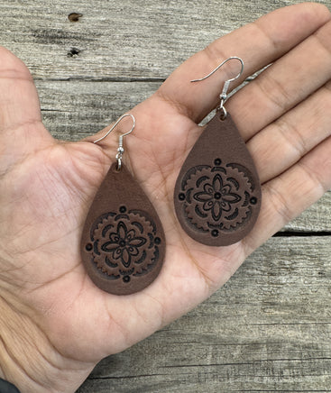 Large hand-stamped leather teardrop earrings with flower and geometric design, chocolate brown with sterling silver hooks, handmade by Cherokee Rose Custom Leather in East Texas.