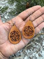 Large light tan teardrop leather earrings with hand-stamped geometric design and sterling silver hooks, handmade by Cherokee Rose Custom Leather in East Texas.