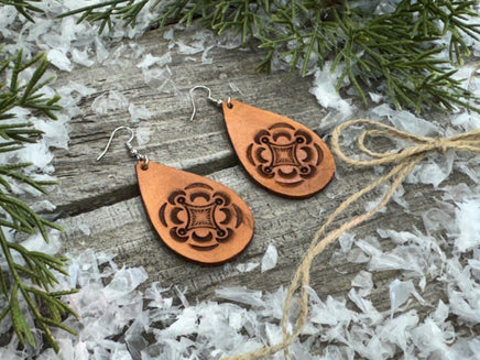Large light tan teardrop leather earrings with hand-stamped geometric design and sterling silver hooks, handmade by Cherokee Rose Custom Leather in East Texas.