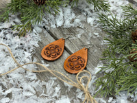 Large light tan teardrop leather earrings with hand-stamped geometric design and sterling silver hooks, handmade by Cherokee Rose Custom Leather in East Texas.
