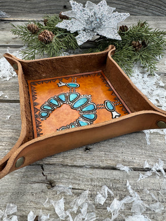 Hand-tooled leather valet tray with turquoise squash blossom necklace design and geometric stamped border, handmade by Cherokee Rose Custom Leather in Texas.