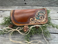 Hand tooled leather eyeglasses case with turquoise feather and floral corner design, handmade by Cherokee Rose Custom Leather