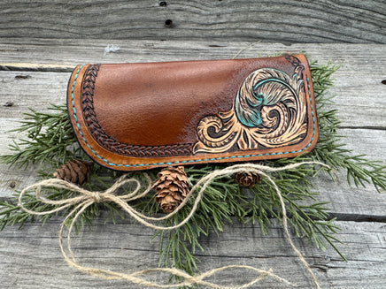 Hand tooled leather eyeglasses case with turquoise feather and floral corner design, handmade by Cherokee Rose Custom Leather