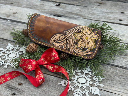 Hand tooled leather eyeglasses case with sunflower floral design and hand stitching, handmade by Cherokee Rose Custom Leather