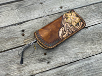 Hand tooled leather eyeglasses case with sunflower floral design and hand stitching, handmade by Cherokee Rose Custom Leather