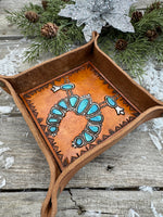Hand-tooled leather valet tray with turquoise squash blossom necklace design and geometric stamped border, handmade by Cherokee Rose Custom Leather in Texas.
