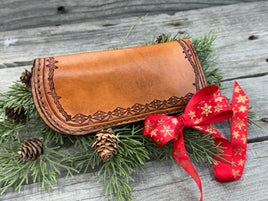 Hand stamped leather eyeglasses case with barbed wire and geometric Western pattern, handmade by Cherokee Rose Custom Leather