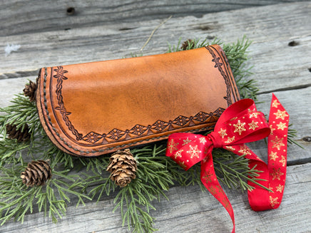Hand stamped leather eyeglasses case with barbed wire and geometric Western pattern, handmade by Cherokee Rose Custom Leather