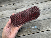 Hand dyed Bordeaux leather eyeglasses case with woven basketweave pattern, handmade by Cherokee Rose Custom Leather