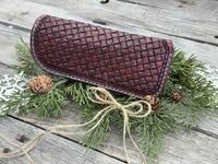 Hand dyed Bordeaux leather eyeglasses case with woven basketweave pattern, handmade by Cherokee Rose Custom Leather