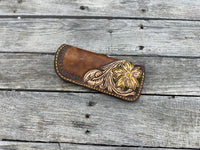 Hand tooled leather eyeglasses case with sunflower floral design and hand stitching, handmade by Cherokee Rose Custom Leather