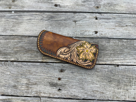 Hand tooled leather eyeglasses case with sunflower floral design and hand stitching, handmade by Cherokee Rose Custom Leather