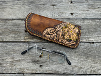 Hand tooled leather eyeglasses case with sunflower floral design and hand stitching, handmade by Cherokee Rose Custom Leather