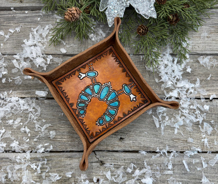 Hand-tooled leather valet tray with turquoise squash blossom necklace design and geometric stamped border, handmade by Cherokee Rose Custom Leather in Texas.