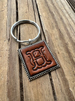 Hand Stamped Leather Initial Keychains – Floral Script Font