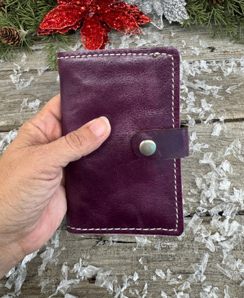 Handmade plum purple oil-tanned leather memo pad holder with cream stitching and antique nickel snap, crafted by Cherokee Rose Custom Leather in East Texas.