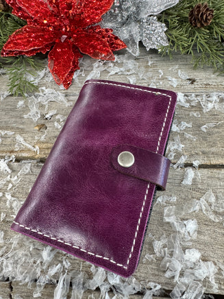 Handmade plum purple oil-tanned leather memo pad holder with cream stitching and antique nickel snap, crafted by Cherokee Rose Custom Leather in East Texas.