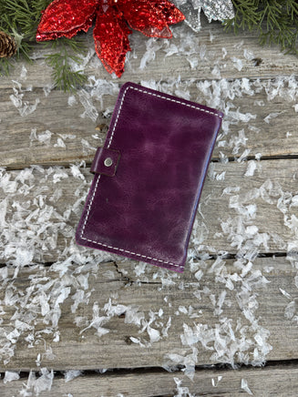 Handmade plum purple oil-tanned leather memo pad holder with cream stitching and antique nickel snap, crafted by Cherokee Rose Custom Leather in East Texas.