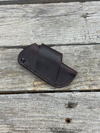 Handmade chocolate brown leather knife sheath with black rivet hardware, horizontal carry design for small pocket knives by Cherokee Rose Custom Leather.