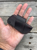 Handmade chocolate brown leather knife sheath with black rivet hardware, horizontal carry design for small pocket knives by Cherokee Rose Custom Leather.