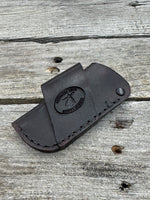 Handmade chocolate brown leather knife sheath with black rivet hardware, horizontal carry design for small pocket knives by Cherokee Rose Custom Leather.
