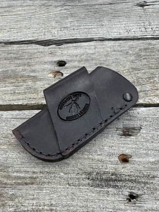Handmade chocolate brown leather knife sheath with black rivet hardware, horizontal carry design for small pocket knives by Cherokee Rose Custom Leather.