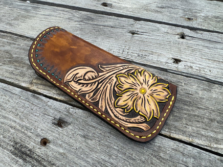 Hand tooled leather eyeglasses case with sunflower floral design and hand stitching, handmade by Cherokee Rose Custom Leather