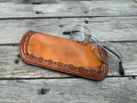Hand stamped leather eyeglasses case with barbed wire and geometric Western pattern, handmade by Cherokee Rose Custom Leather