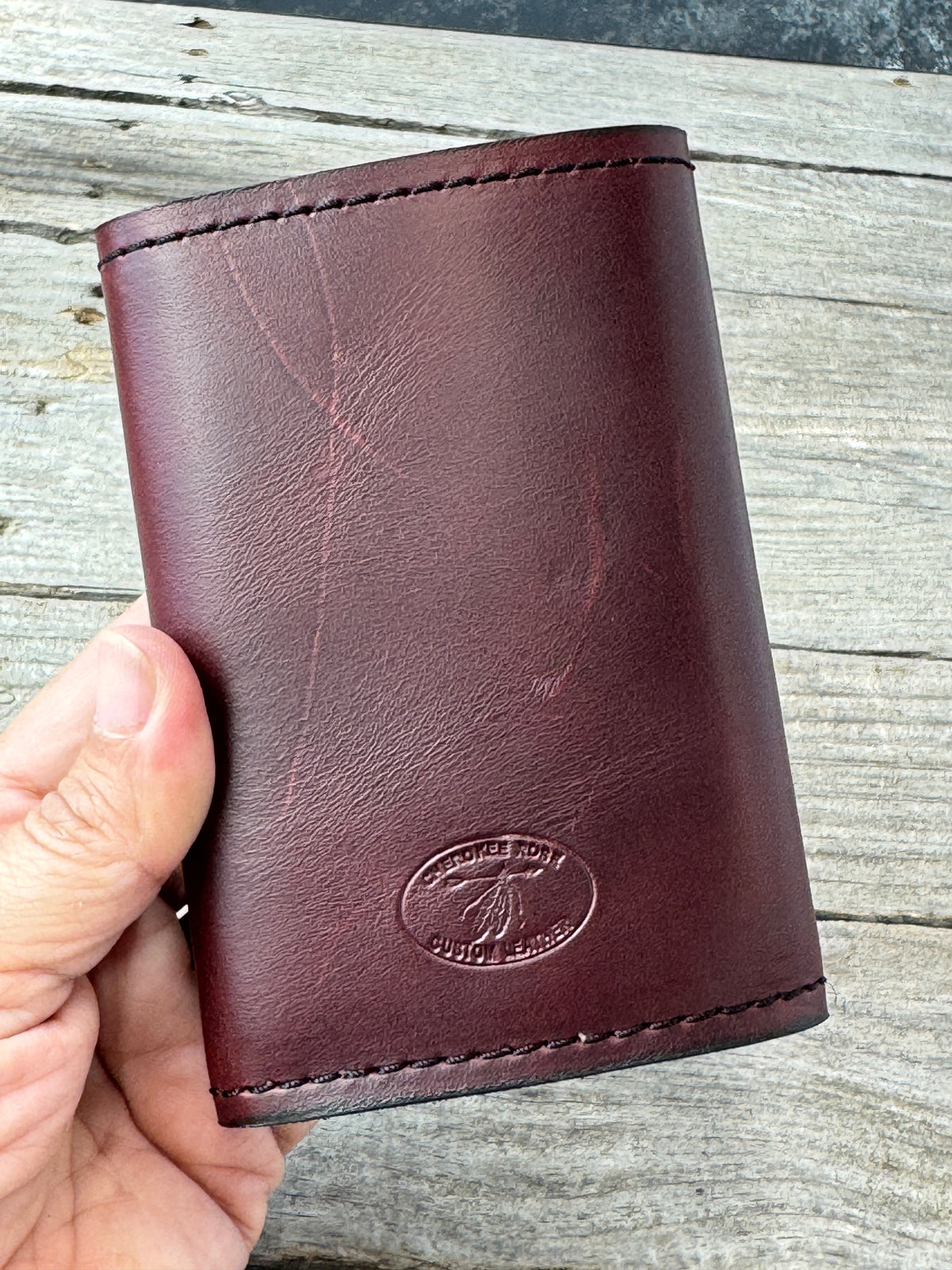 Bayou Red Brown full grain leather trifold wallet showing rich red brown finish