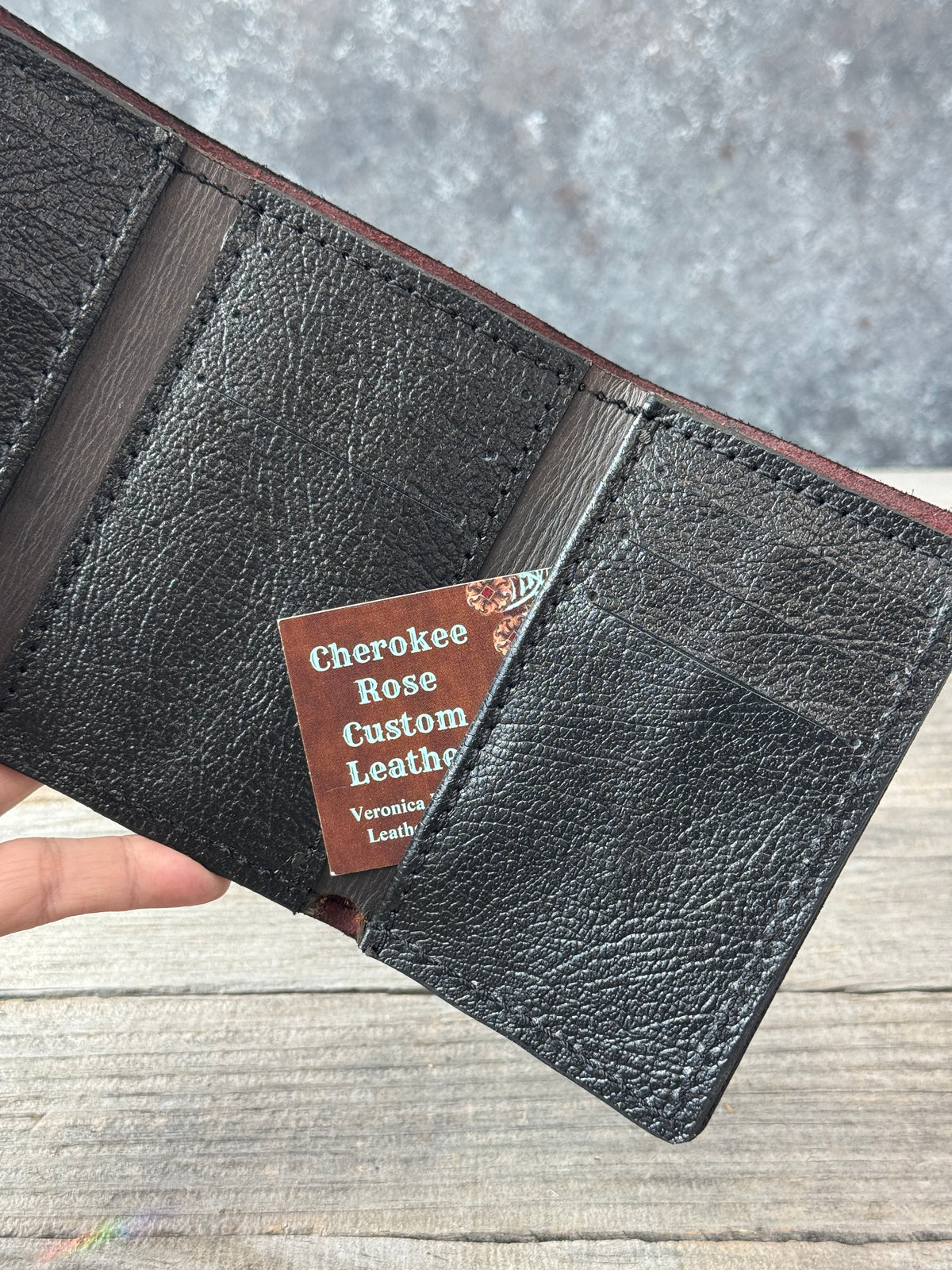 Bayou Red Brown trifold wallet with textured black pigskin card pockets