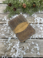 Rustic beige oil-tanned leather card wallet with blue hand stitching, handmade by Cherokee Rose Custom Leather in East Texas.