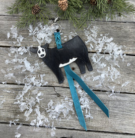 Hand-painted black and white leather show heifer purse hanger (“panda cow”) with turquoise suede strap, handmade by Cherokee Rose Custom Leather in Texas.