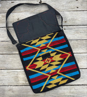 Southwest woven messenger bag with two hand-tooled and painted cactus leather patches stitched in red thread by Cherokee Rose Custom Leather.