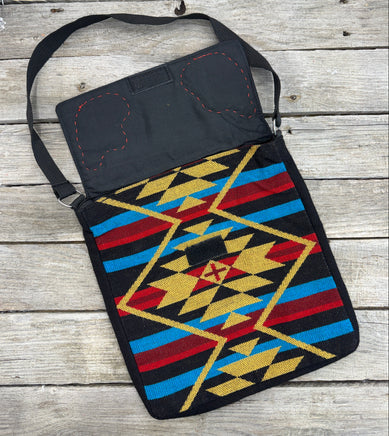 Southwest woven messenger bag with two hand-tooled and painted cactus leather patches stitched in red thread by Cherokee Rose Custom Leather.