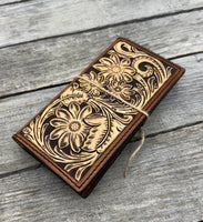 Hand carved floral leather checkbook cover with tooled floral design and oil tanned leather interior