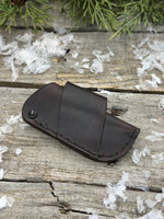 Handmade chocolate brown leather knife sheath with black rivet hardware, horizontal carry design for small pocket knives by Cherokee Rose Custom Leather.